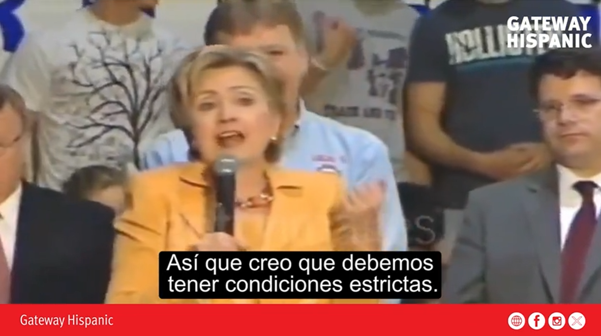 Hillary Clinton speaks passionately at a campaign event, emphasizing the need for strict conditions while addressing a diverse audience.