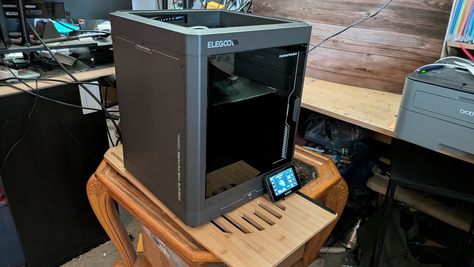 Elegoo Centauri Carbon 3D Printer in crowded garage