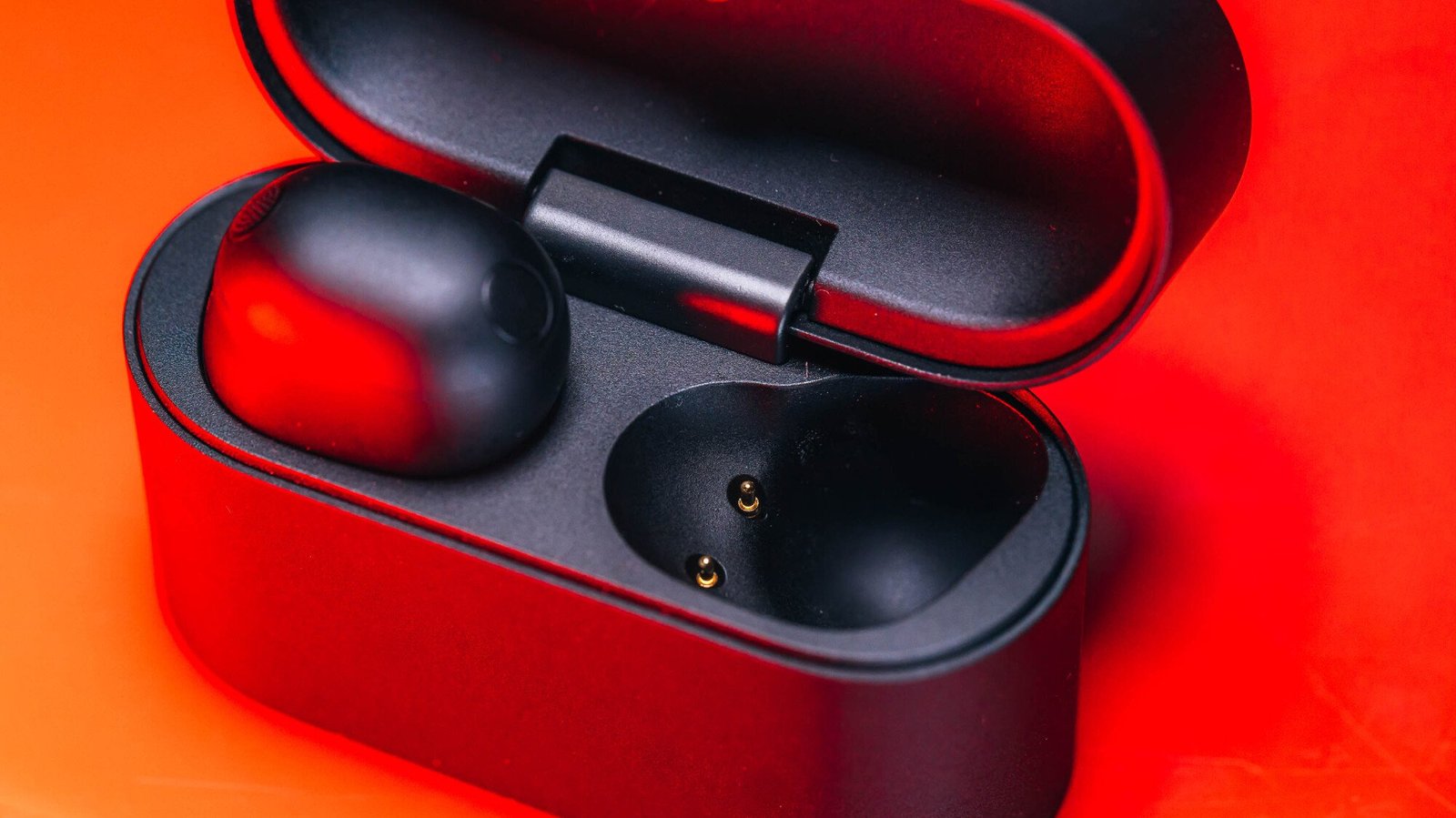 sony xm6 earbuds case open with one left earbud in the case