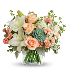 Flower bouquet featuring lilies, roses, and a succulent