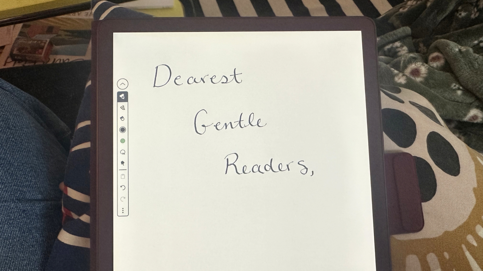 A Kindle Scribe Colorsoft showing handwriting in a notebook.
