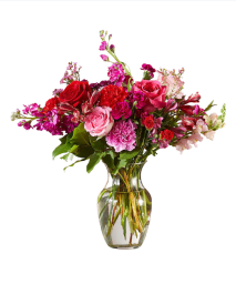 Vase of purple, pink, and red flowers