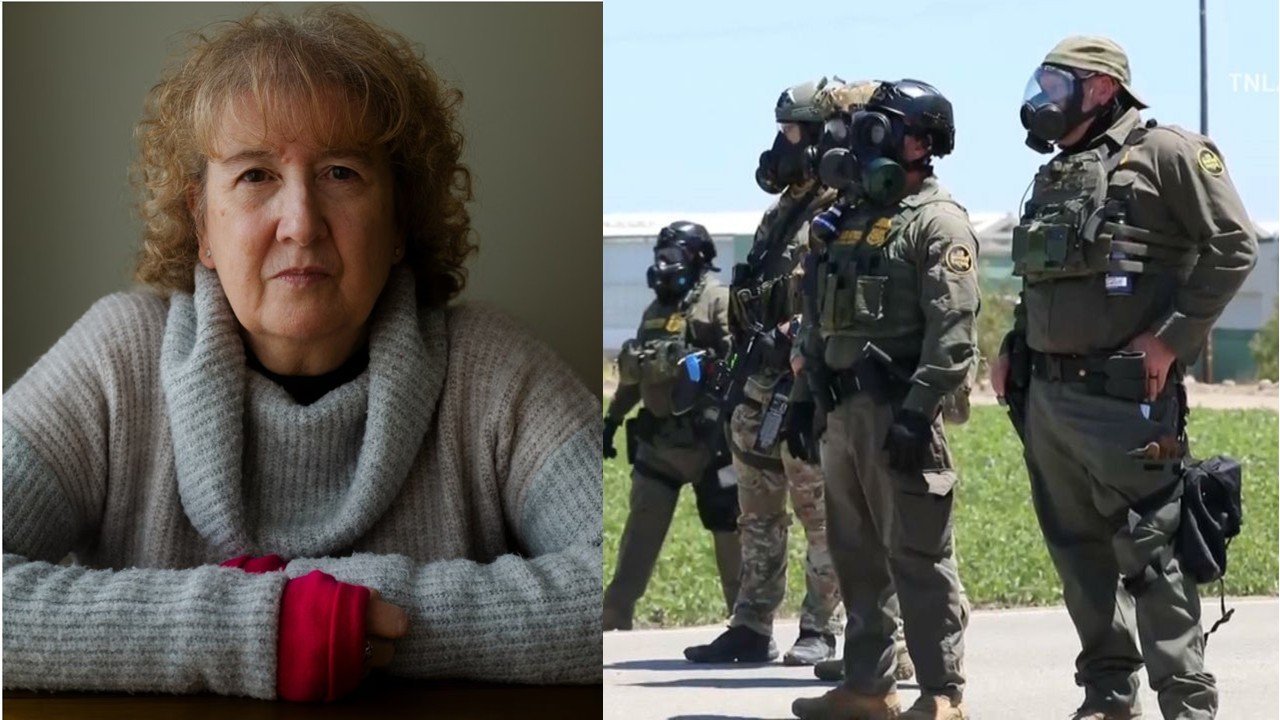 Portrait of a woman with curly hair in a sweater alongside a group of armed law enforcement officers in tactical gear and gas masks outdoors.