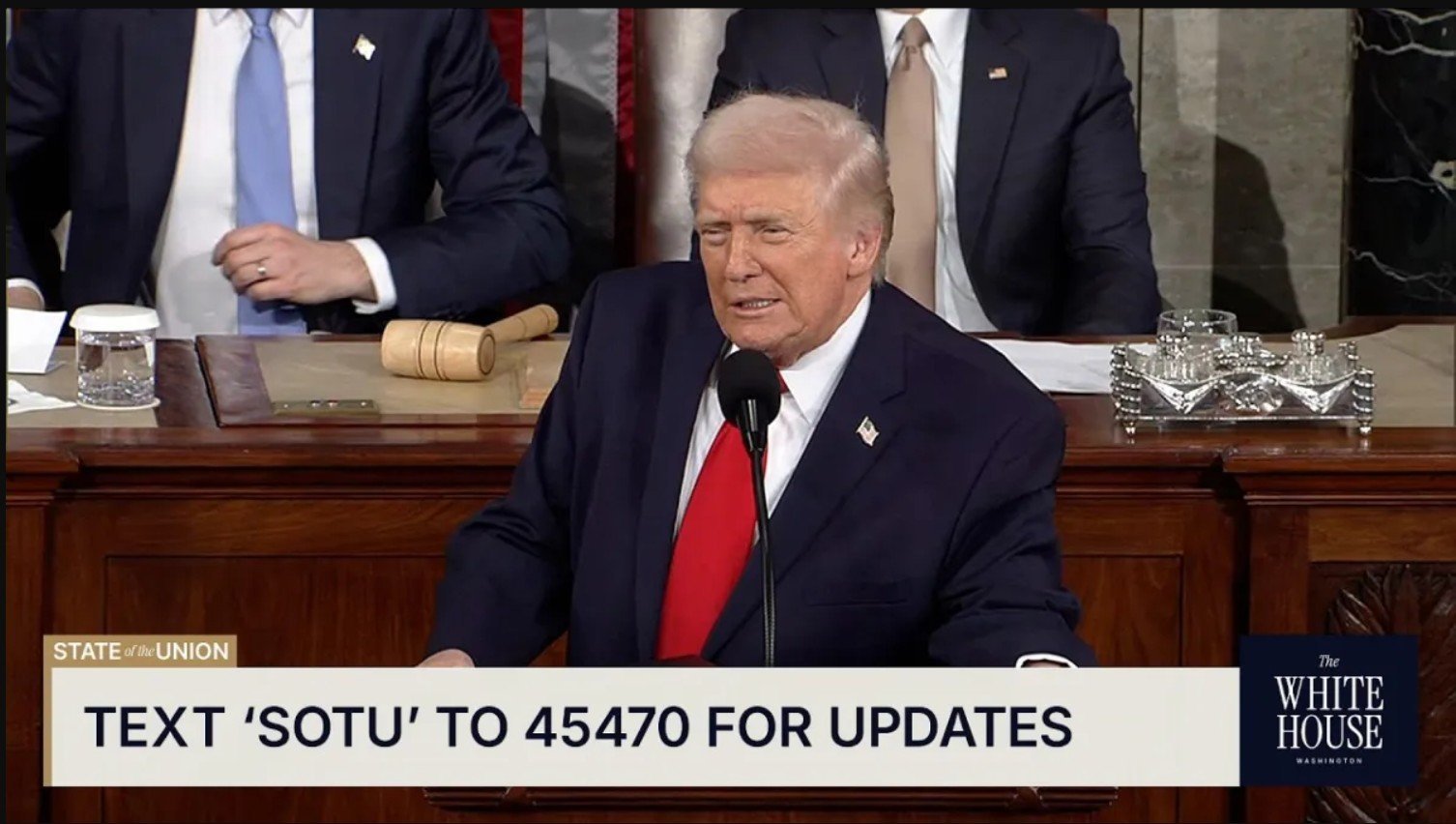 Donald Trump delivers the State of the Union address, with a gavel and water glass visible on the table, emphasizing the importance of civic engagement.
