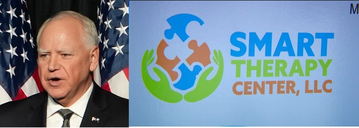Image of a speaker addressing an audience with American flags in the background, alongside the logo of Smart Therapy Center, LLC featuring colorful puzzle pieces and hands.