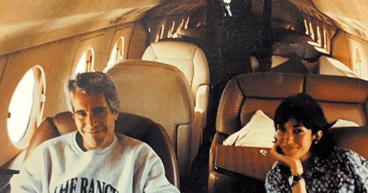 Interior of a private jet featuring two people seated, showcasing luxury travel and a spacious cabin environment.