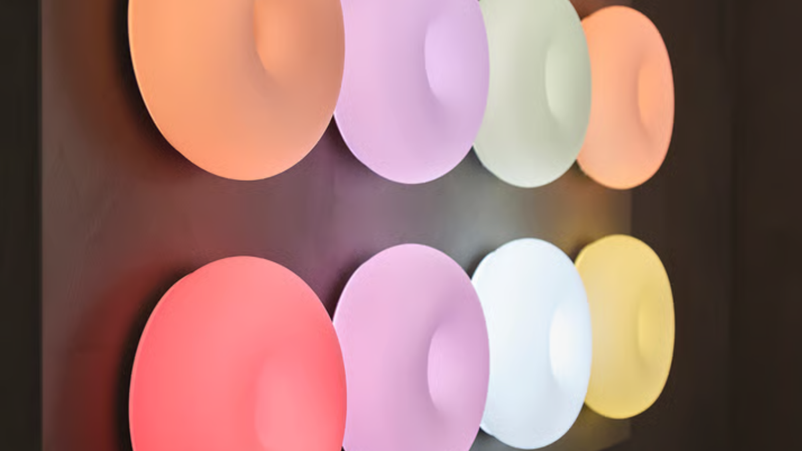 Eight Varmblixt lamps on a wall