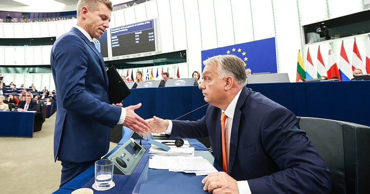 European Parliament session featuring a handshake between two politicians, with flags in the background and a focus on diplomacy and political engagement.