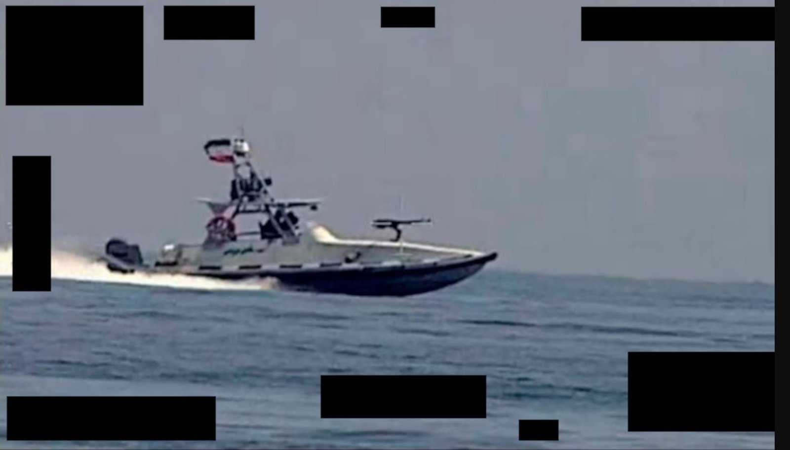 Armed patrol boat navigating through open water, showcasing advanced military capabilities and design.